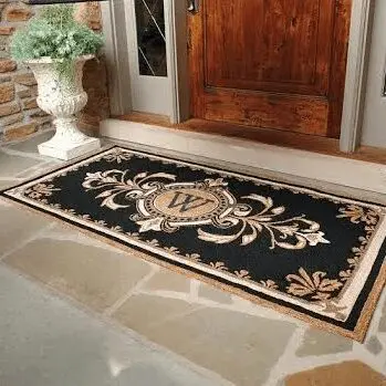 A decorative doormat at a front door