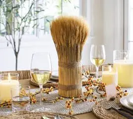 A table set with candles and wine glasses.