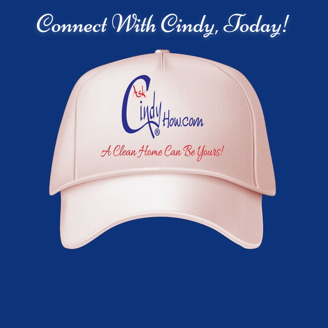 a pale pink hat with the Askcindyhow logo on it on a blue background