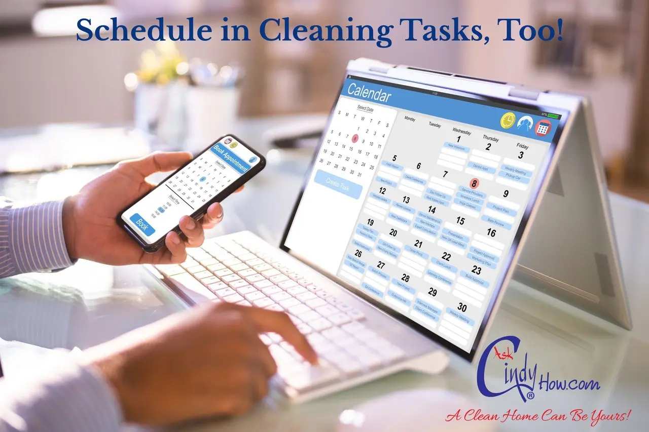 Person scheduling tasks on tablet and phone.