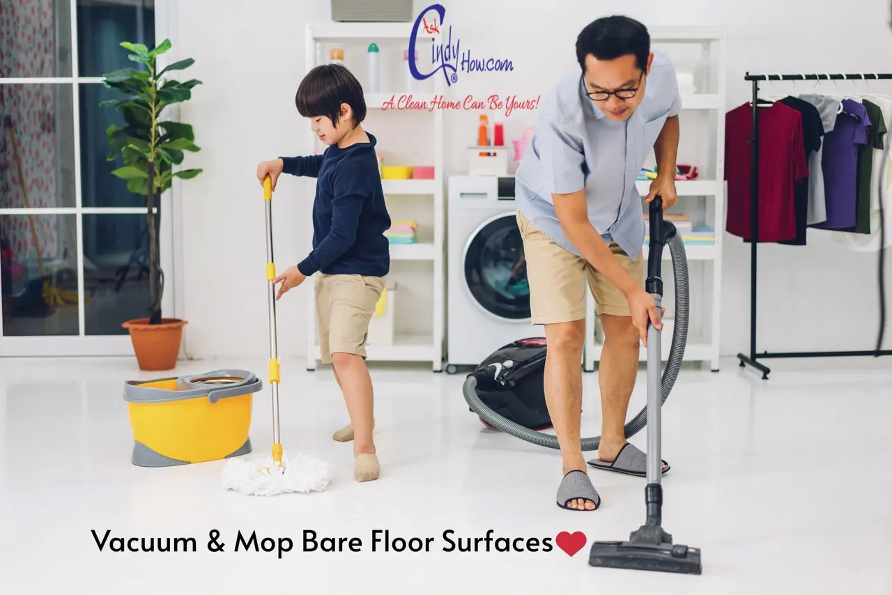 Father and son cleaning the floor together.