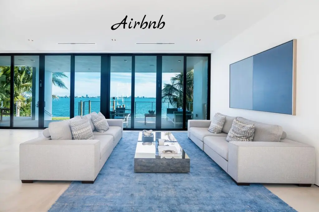 a clean living room overlooking the water