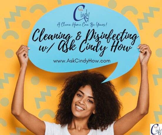a young woman holding a sign with the  Ask Cindy logo and text that reads: "Cleaning & disinfecting w/ Ask Cindy How"