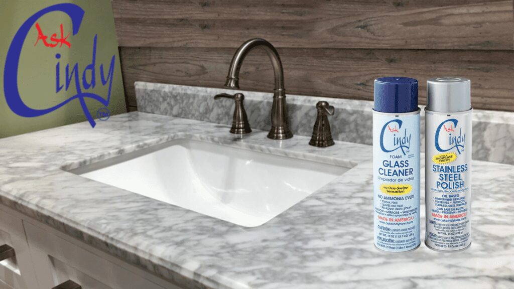 a clean sink, foam glass cleaner, and stainless steel polish