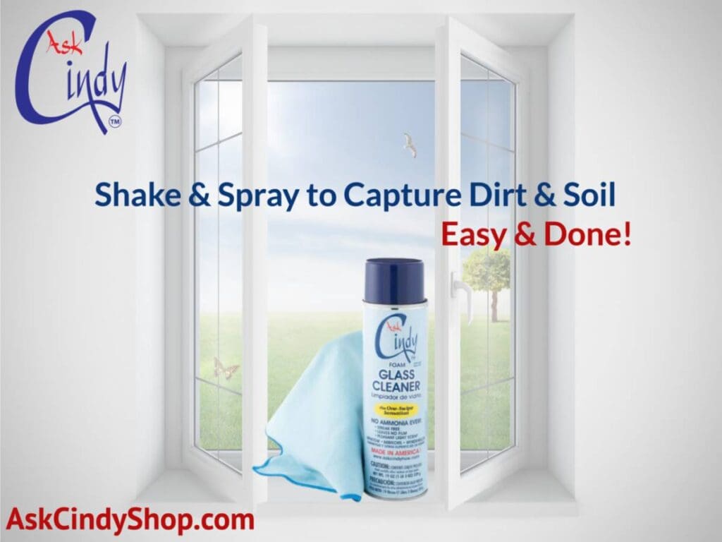 Image of an open window with a can of Ask Cindy How glass cleaner and a towel. Text says: "Shake & spray to capture dirt & Soil, Easy & Done!"