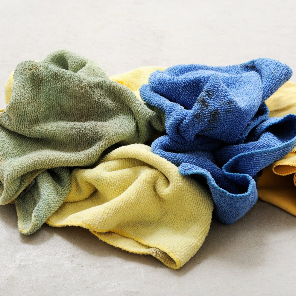 Used cleaning towels stained with dirt and grime, ready for a thorough wash.