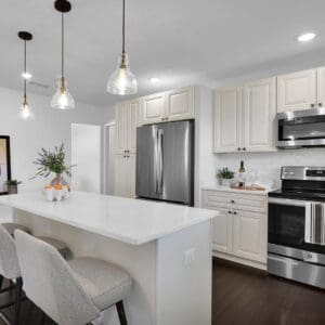 a clean pearl white kitchen